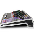 Side view of 12 Channel Pro Audio Mixer With 99 DSP Processing, USB MP3 Bluetooth, Dual 7 Band EQ On Every Channel, 48V Phantom Power, Mute And Recording Capable Triton TX1202 featuring multiple knobs and sliders.
