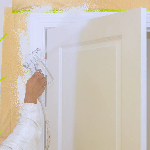 Painting a door with spray gun using Masking Paper And Tape Set For Painting Projects 4 Rolls 50 Feet Each Assorted Sizes.