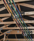 Hadwoer Cable Chase Wire Bracket 10 Pack NM Cable Organizer with 13 holes holding multiple cables securely in a wooden structure.