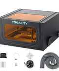 Creality Laser Engraver Enclosure 2.0; black metal housing with orange viewing window, includes exhaust hose