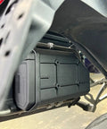 Close-up of Badass Motorcycle Side Tool Box For CRF1000L Cargo Rack showcasing heavy-duty metal build and secure fit.