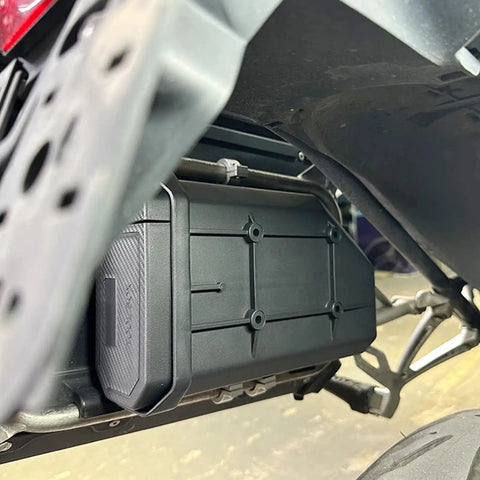 Close-up of Badass Motorcycle Side Tool Box For CRF1000L Cargo Rack showcasing heavy-duty metal build and secure fit.