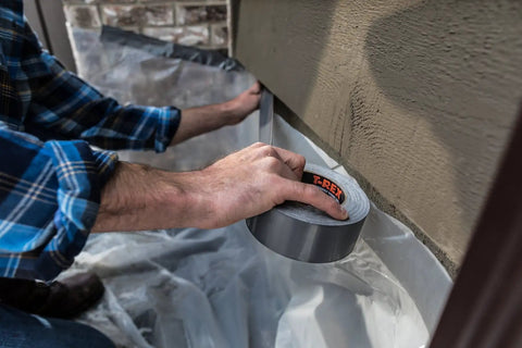 Applying Ferociously Strong Duct Tape One Point Eight Eight Inch By Thirty Five Yard Dark Gunmetal Gray One Roll With Premium Adhesive UV Resistant