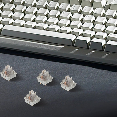 10 Piece Linear Mechanical Keyboard Switches Featuring Three Legged Design And Anti Wear Build Crafted From Sturdy Abs And Metal For Hella Smooth Typing That Truly Levels Up Your Setup on a desk with a keyboard.