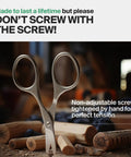 Self Sharpening Titanium Coated Nail Cutter Scissors For Pro Manicure, High Carbon Steel Durability on a wooden surface.