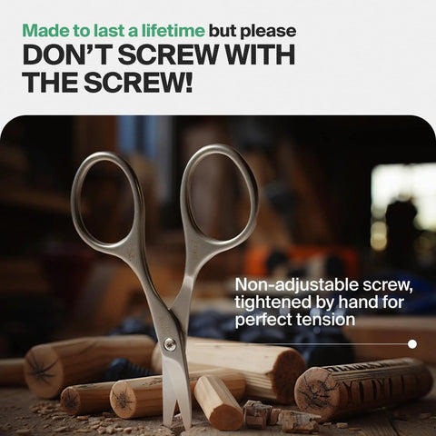 Self Sharpening Titanium Coated Nail Cutter Scissors For Pro Manicure, High Carbon Steel Durability on a wooden surface.