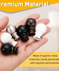 Hand holding various lamp finials including 2 Pack 1.5 Inch Tall Lamp Finials White And Gold With 1/4-27 Thread Cap Knobs And Cleaning Cloth For Table And Floor Lamps Shade Holder Decor