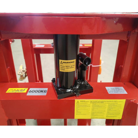 Close-up of Economical Heavy Duty Hydraulic Machinery And Equipment Mover With Adjustable Forks Up To 12000 Lb Capacity, hydraulic cylinder
