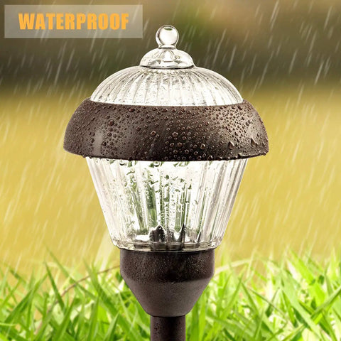 4 Pack High Lumen Metal Solar Pathway Lights With 2 Bright LED Per Light IP65 Waterproof on wet grass background