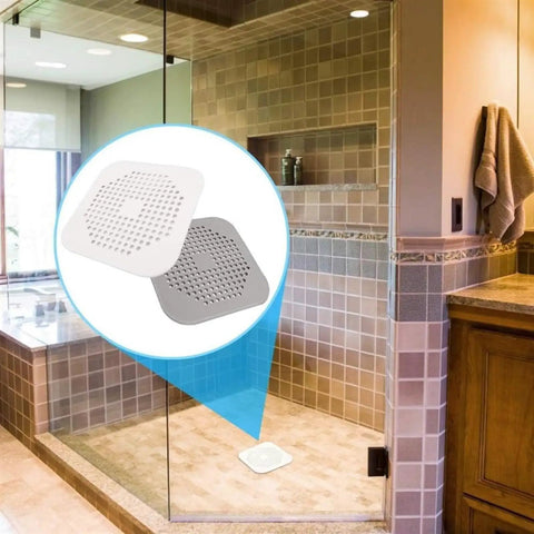 3 Pack 5.5 Inch Silicone Drain Covers With Strong Suction Bases Flat Square Hair Catchers For Showers And Kitchen Sinks Reusable Gray Strainers displayed in modern bathroom setting.