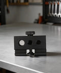 Heavy Duty Black Aluminum Igt Table Track Slider Clamp Mount with three ports on a workbench for outdoor plug and play setups