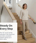 Person using Oak Wood Wrapped Aluminum Core Handrail Kit For Indoor Stairs 3 Feet Long With 1.6 Inch Round Railing TrueWood Look ADA Compliant