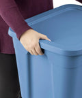 Person holding the Straight Up Beast Mode 18 Gallon Plastic Storage Bin With Secure Snap On Lid Stackable Heavy Duty Moving Container For Workshop Home Office Or Backyard Shed Blue.