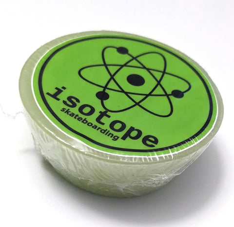Lime green round wax with 'isotope skateboarding' text, labeled as Premium Skateboard Wax For Rails 70g Curb Wax Made In The USA With Nag Champa Scent Perfect For Smooth Grinds And Rails High Quality Paraffin Blend For Long Lasting Sliders.