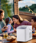 Grab And Go Countertop Ice Maker With Handle Portable Ice Machine on outdoor table with family