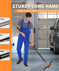 Person using Heavy Duty 2-In-1 Floor Squeegee Workhorse with 16-Inch Rubber Blade and 6-Inch Scrub Brush in a garage
