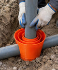Heavy Duty Steel Electrical Conduit Pipe Connector Locking Coupler For Outdoor Junction Boxes in use with gripping gray pipe.