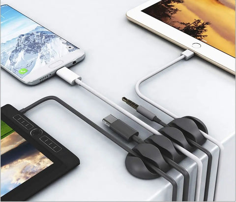 Close-up of 16 Pack White Self Adhesive Cable Clips For Desk And Nightstand Cable Management organizing multiple device cords.