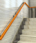 Hold On Tight Heavy Duty Stair Handrail And Hallway Safety Rail Featuring Slip Resistant Wood Grip And Rock Solid Wrought Iron Brackets For Wall Mount Installation Perfect For Senior Support And Easy Setup mounted on a stairway.
