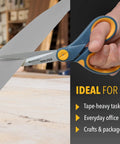 Person cutting with Eight Inch Nonstick Titanium Scissors With Glide Adjust Technology For Office And Home, Grey And Yellow