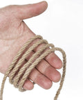 Rugged 5mm Natural Jute Twine Heavy Duty Rope, 328 Feet, Boss Grade for DIY Crafts held in hand, showing texture and thickness.