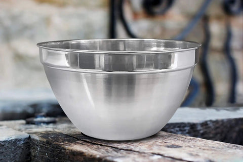 V Shaped Stainless Steel Mixing Bowl, 3 Quart Capacity, Deep Bowl Design To Cut Splatter, Polished Finish on wood surface