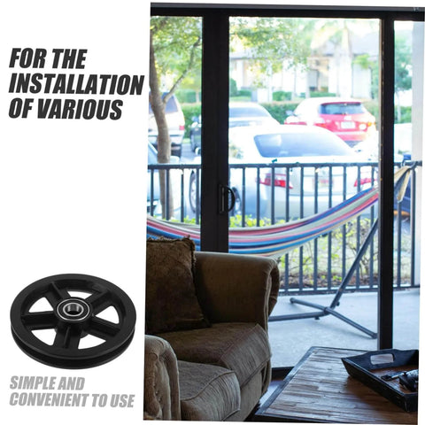 Pro Grade Heavy Duty Roller Guide Wheel Set for Sliding Doors and Barn Door Tracks next to a window with a couch and hammock outside.