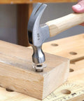 Heavy Duty M8 Tee Nuts 10mm Barrel 304 Stainless Steel Four Pronged Threaded Inserts being hammered into wood.