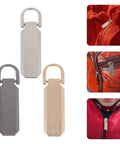 Heavy Duty Metal Zipper Pull Tabs Replacement Set With Super Straightforward Tool Free Install For Jacket Fixes Clothing Repairs And Gear Upgrades In A Compact 12 Piece Pack That Gives You Zero Sweat Quick Repairs Every Single Time - Three zipper pulls in silver, black, and gold colors, showcasing their easy installation on jackets.