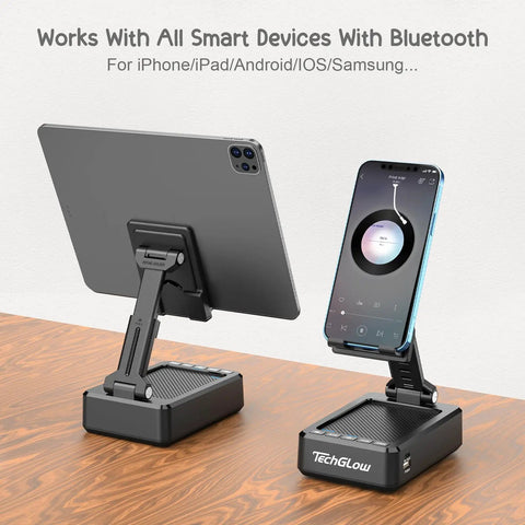 Foldable Phone Stand With Bluetooth Speaker And Built In Charging Station 3 In 1 Desk Gadget holding tablet and smartphone