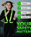 Woman jogging in urban area wearing high visibility reflective vest with safety icons for jogging, walking, cycling, and workers.