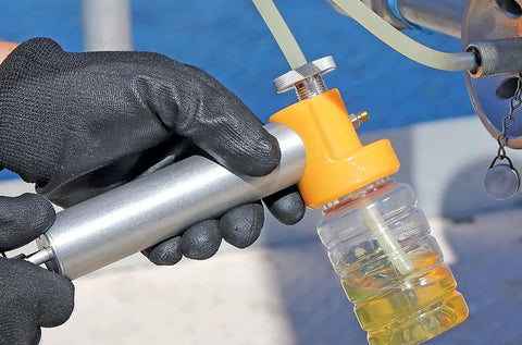 Oil Sampling Pump That Makes Oil Analysis Quick And Safe No Fuss Vacuum Release Valve For Spill Free Sampling fits hose in use