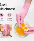 Hands wearing Top Shelf Nitrile Exam Gloves With Slick Fit And Rock Solid Protection For Medium Hands Cherry Blossom Scented breaking an egg.