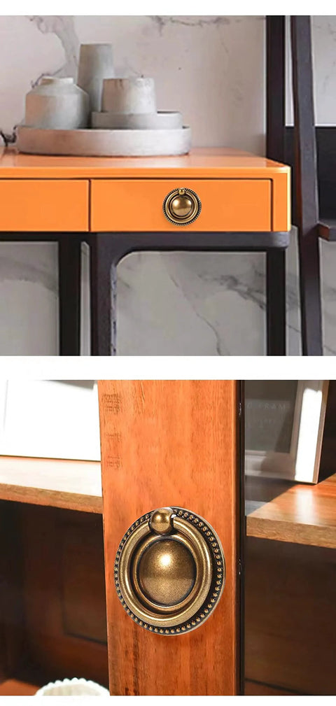 8 Pack 2 Inch Antique Brass Ring Drawer Pulls With Round Plate Base for cabinets and cupboards, shown installed on furniture.
