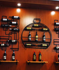 Badass Rock Solid Heavy Duty Wall Wine Rack With Rust Proof Iron Construction Stemware Holder And Spacious Floating Bar Shelf mounted on wooden wall.