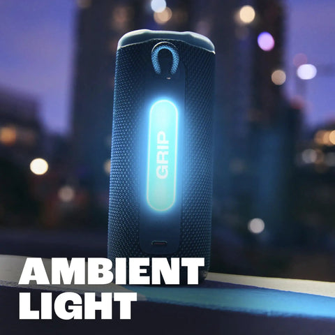 Grip Compact Bluetooth Speaker With Bold Pro Sound And Ambient Light, glowing in dark urban setting