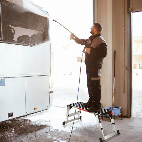 40 Inch Folding Step Stool Aluminum Ladder For Home DIY Projects used by man pressure washing a bus indoors