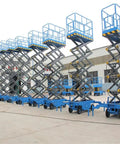 Heavy Duty Electric Hydraulic Scissor Lift Table Mobile Industrial Cargo Platform 16 Feet adjustable scissor lifts lined up on site.