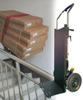 Heavy Duty Electric Stair Climbing Hand Truck With Aerospace Steel Frame For 880 Lb Loads, handling stacked boxes on stairs.
