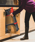 Person storing Lightweight Aluminum Telescoping A-Frame Ladder 5 Ft Portable Multi-Purpose Folding Step Ladder in kitchen cabinet