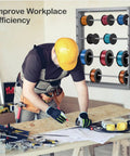 Heavy-Duty Wire Spool Rack Wall Mount With Four Adjustable 5/8 Inch Rods in workshop, holding multiple colored spools, gray steel.