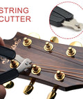 Saphue 3 In 1 Multifunction Guitar String Winder Cutter Pin Puller For Bass And Banjo, showing string cutter in use on guitar headstock.