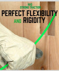 Gloved hand using 33 Inch Fiberglass Electrical Fish Tape Kit With Glow Rods through wooden wall opening