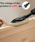 Edge banding iron with beige fabric pad and black handle pressing a wood edge.
