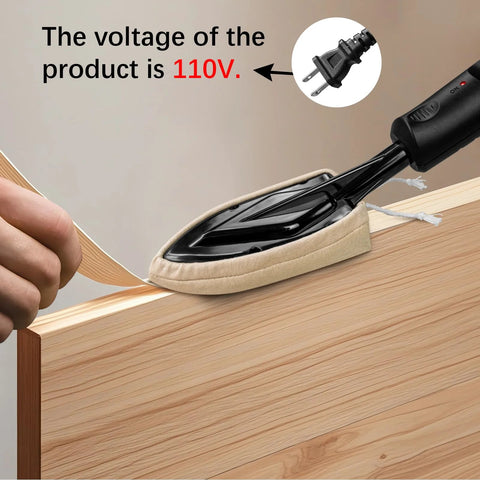 Edge banding iron with beige fabric pad and black handle pressing a wood edge.