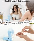 Blue Power Bank Handheld Fan With 4500mAh Battery Folding Personal Fan, woman applying makeup, fan on table, USB charging port
