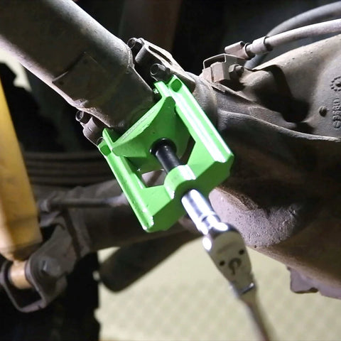 Beefy Heavy Duty U Joint Puller For Intermediate Trucks Buses And Farm Equipment shown disassembling driveline.