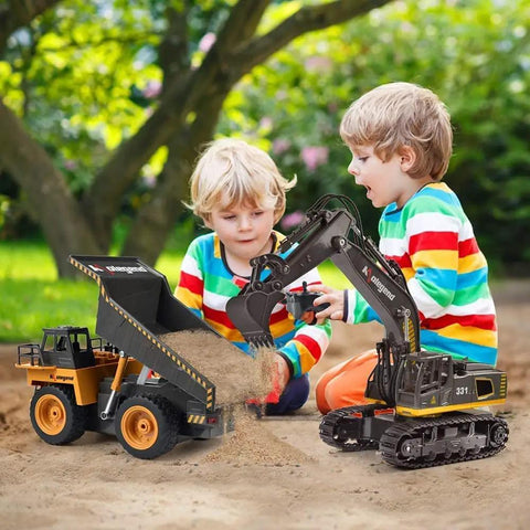 Two children playing with Remote Control Dump Truck For Kids And Toddlers, Realistic RC Construction Vehicle outdoors in the sand.