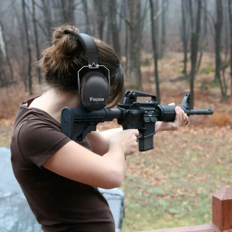 Person using 34dB NRR Ear Protection For Shooting And Loud Events Compact Adjustable Safety Ear Muffs Defenders