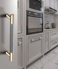 12 Pack 3 Inch Barrel Cabinet Pulls Gold And Grey Aluminum Handles For Cabinets And Drawers in a kitchen setting